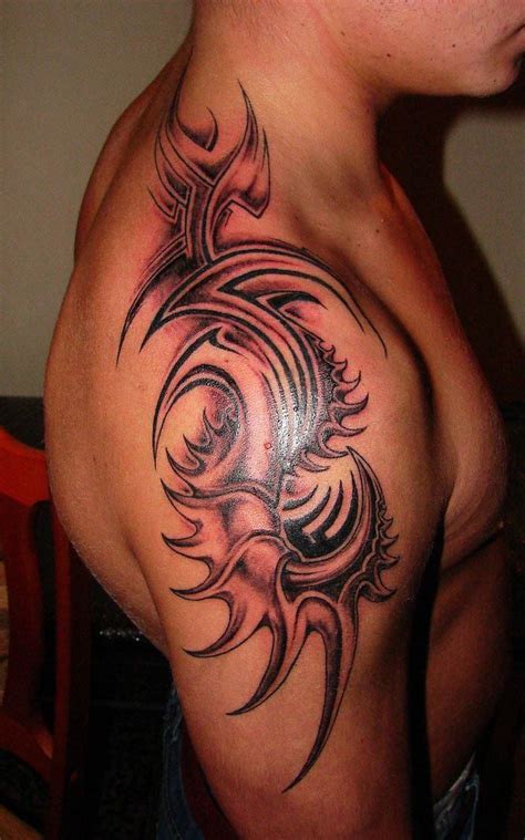 Round tattoos is gaining attention these days. Round tribal tattoo design on shoulder for guys | Tribal ...