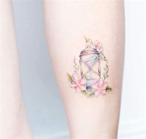 Tattoo Hourglass And Flowers Flower Tattoo Designs Tattoo Designs For Women Feminine Tattoos