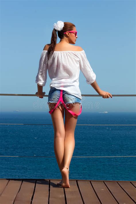 While backbends strengthen the back muscles, stretch the front body and the shoulders and help it's often tightness in the hip flexors, the shoulders, or the side body that compromises your form in yoga. Backside Of Fashionable Girl In Denim Shorts Stock Image - Image of sensuality, healthy: 33238129