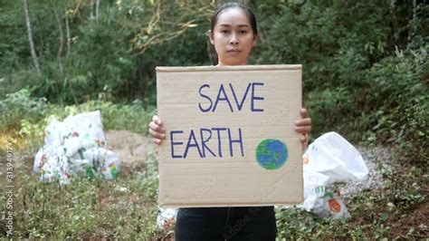 The Babe Woman Holding Save The Earth Poster Showing A Sign Protesting Against Plastic