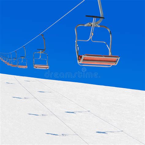 Winter Ski Lift In Snowy Mountains Against Blue Sky Stock Image Image