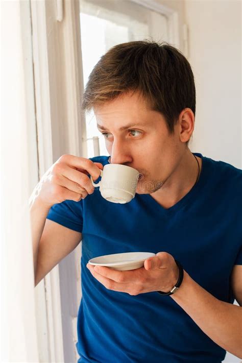 Man Drinking Coffee Looking Out The Window Stock Image Image Of