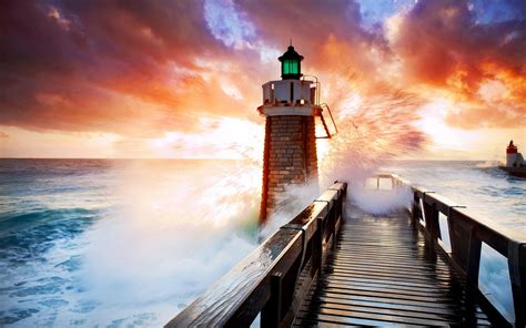 Lighthouse In Stormy Sea At Sunset Hd Wallpaper Background Image 1920x1200 Id813763