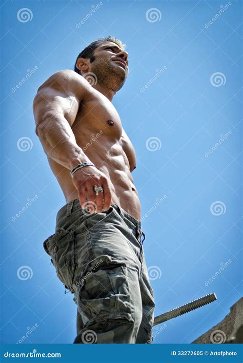 Hot Muscular Construction Worker Shirtless Seen From Below Stock Image