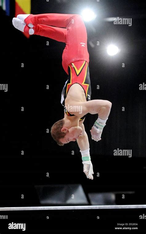 German Gymnast Fabian Hambuechen Performs His Exercise During The Mens High Bar Final At The