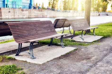 Wooden Benches In A Park Near The Riverside At Sunset Stock Image