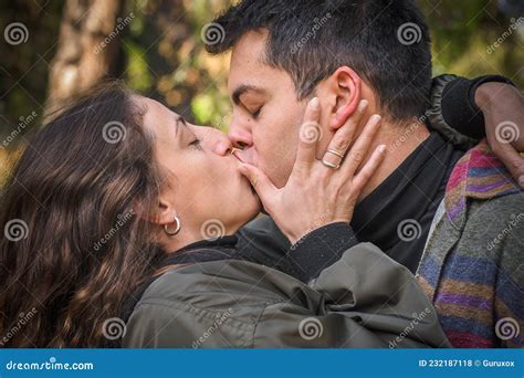 Close Up Of French Kiss Couple In Love Hugging And Kissing Stock Photo Image Of Park Outdoor