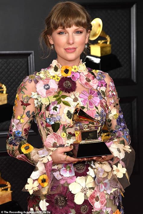 grammys 2021 winner taylor swift wears dress covered in embroidered flowers on awards red