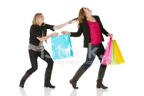 Woman Snatching Shopping Bag From Her Friend Stock Photo Royalty Free