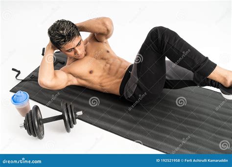 Full Body Image Of Muscle Man Without Clothes Do Sit Up Exercises With