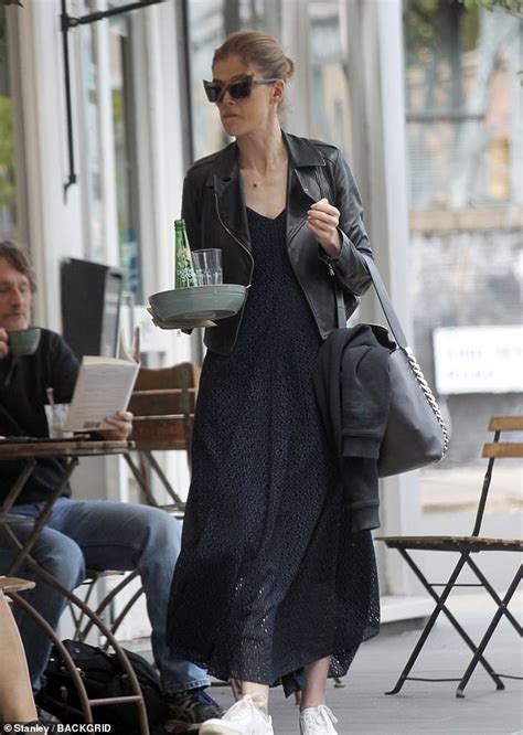 Rosamund Pike Looks Stylish In A Black Maxi Dress And Leather Jacket