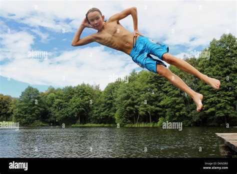 Emstal Germany Boy Jumping In A Cool Pose In The Pool Into The Water