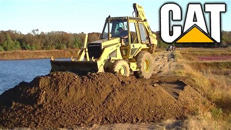 Your name or email address: CAT Caterpillar 416 Backhoe Leveling Gravel - YouTube