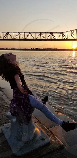 Teen Girl Taking In The Riverside Sunset By Nykita King Photo Stock