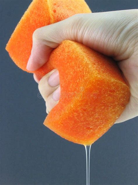 Squeeze It A Hand Squeezing Water Out From A Wet Orange Sponge Ad
