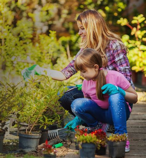 Mother And Daughter In Garden Suttons Gardening Grow How