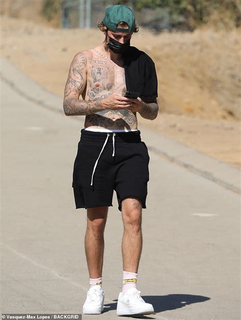 Justin Bieber Takes Calls On A Shirtless Hike In LA After A Gym Session With A Buddy Daily