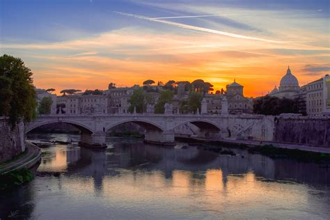 The Tiber River At Sunset Rome Looking Towards St Peters Basilica