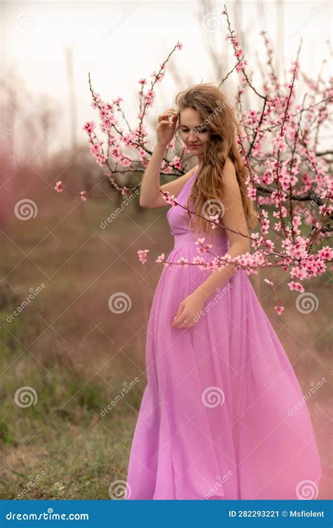 Woman Peach Blossom Happy Curly Woman In Pink Dress Walking In The