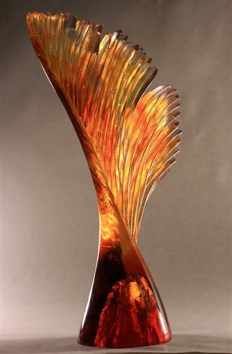 An Artistic Glass Sculpture Is Displayed On A Table