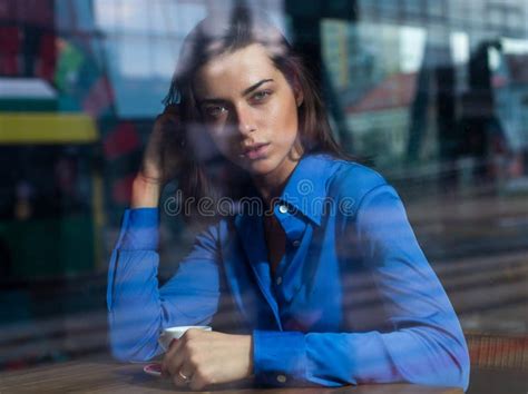 Thoughtful Concept Woman At A Cafe While Gazing Through The Window