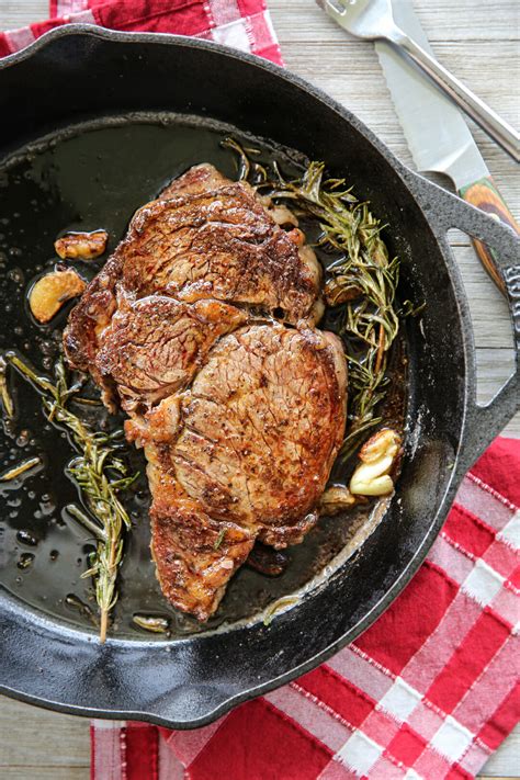 Add butter, rosemary, and garlic to skillet, tilt pan toward you so that butter pools on one side, and use a large spoon to continually baste steak with butter. How to Cook the Perfect Butter-Basted Skillet Steak - Our ...