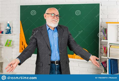 Senior Intelligent Man Teacher At Chalkboard Teacher Old School