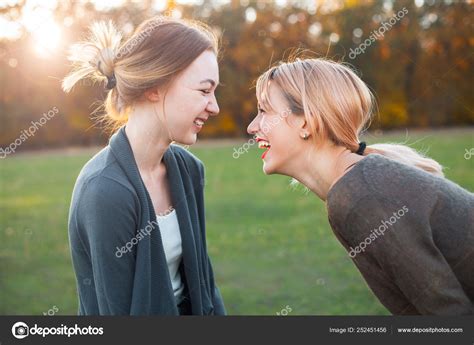 Two Best Friends Laughing Outdoors Stock Photo By Dima Aslanian