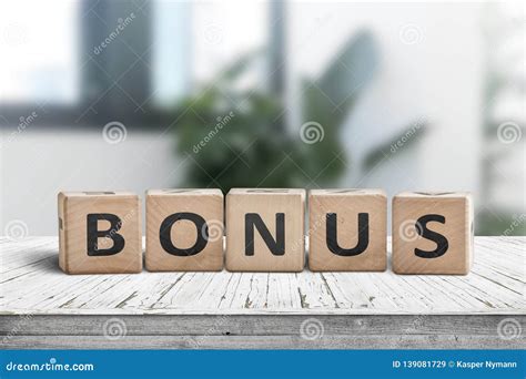 Bonus Reward Sign On A White Table In A Bright Office Stock Image