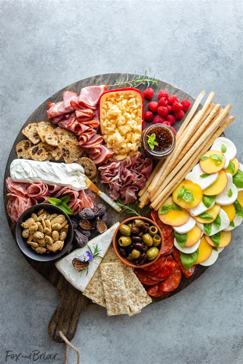 A delicious baked potato dinner board with all your favorite toppings, perfect for a casual party! How to make a Summer Charcuterie Board - Fox and Briar