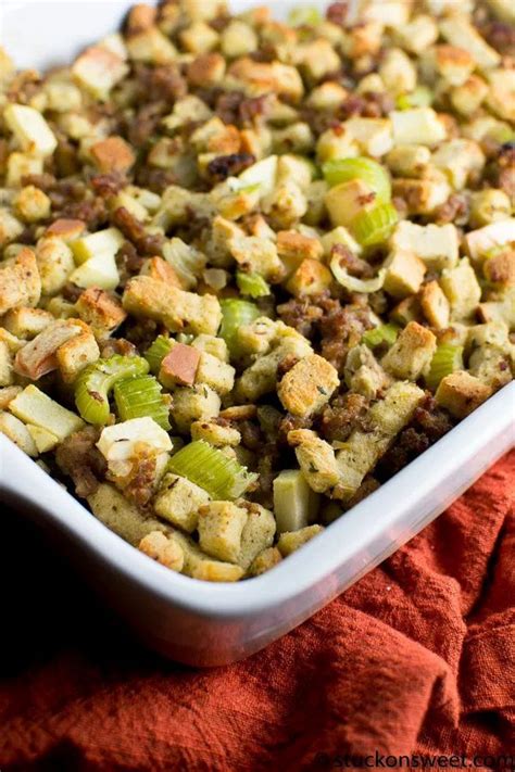 a casserole dish filled with stuffing and vegetables