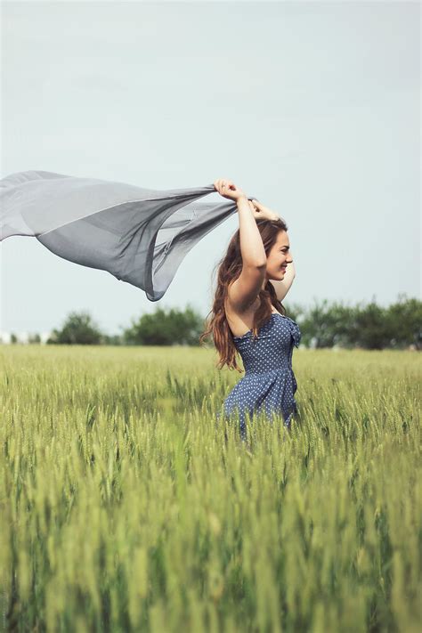 Young Woman Holding A Scarf In A Field By Stocksy Contributor Jovana Rikalo Stocksy