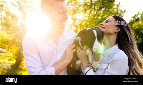 Romantic Couple In Love Walking Dogs And Bonding Stock Photo Alamy