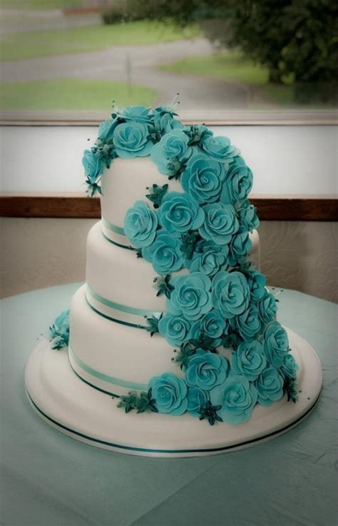 Teal pops with bright white, and its color wheel match is coral. Teal Rose Wedding Cake - CakeCentral.com
