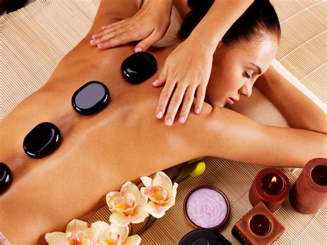 Adult Woman Having Hot Stone Massage In Spa Salon Spas In Canada