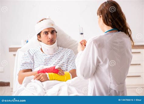 The Young Doctor Examining Injured Patient Stock Photo Image Of Brace