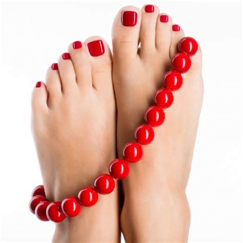 Closeup Photo Of A Beautiful Female Feet With Red Pedicure Stock Photo Valuavitaly