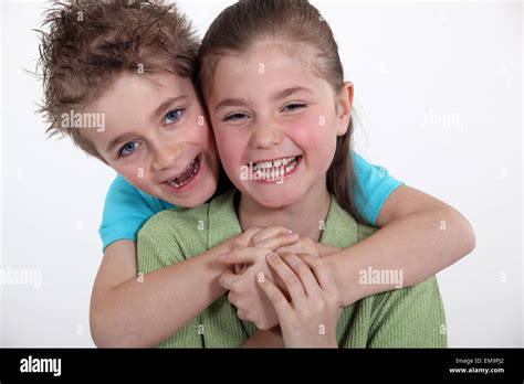 Brother And Sister Hugging Stock Photo Alamy
