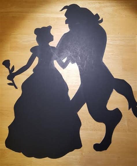 Disney fans of all ages will cherish this figurine and the classic message on its base. 'Beauty and the Beast' silhouette by Thastygliax on DeviantArt