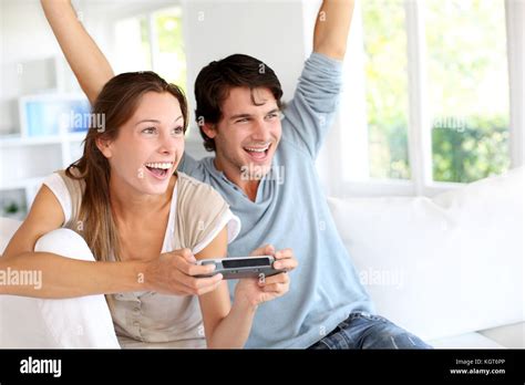 Young Couple Playing Video Games At Home Stock Photo Alamy