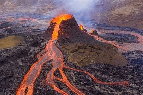 People Play Volleyball In Front Of Erupting Volcano In Iceland