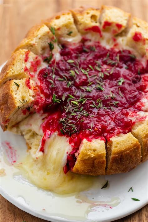 You can use a wheel of brie or a wedge. Baked Brie Cranberry in Bread Bowl | FeelGoodFoodie