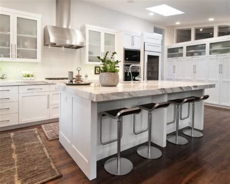 The narrow marble kitchen island with black legs also feels true to the home's architectural integrity. The Awesome and Best Style of Small Kitchen Island with ...