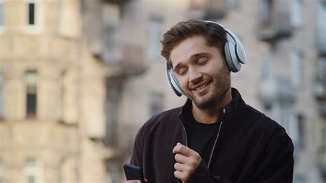 Portrait Of Happy Man Listening Music Via Stock Footage Sbv 338586907