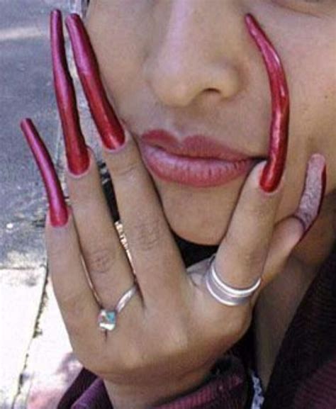 long red nails long fingernails glossy lips makeup lip makeup curved nails weird fashion