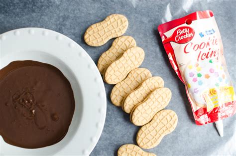 Refrigerate the truffles to set the chocolate for about 20 minutes. football nutter butter decorated cookies-1 - A Grande Life