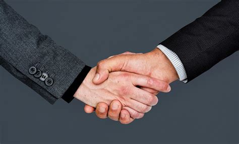 Two Business People Shaking Hands Free Stock Photo 414148