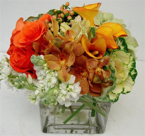 We did not find results for: This is a cube vase floral arrangement that features roses ...