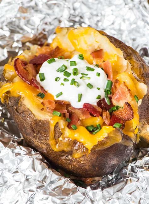 These slow cooker potatoes are as easy as scrub, poke, oil down and set and forget in your favorite crock pot. How to Make Crock Pot Baked Potatoes | Well Plated by Erin