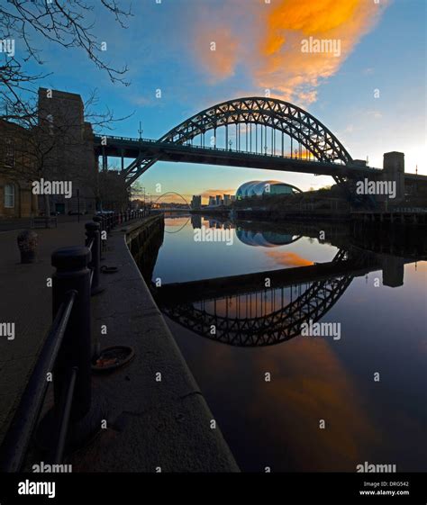 The Tyne Bridge At Dawn Reflected In The River Tyne Newcastle Upon